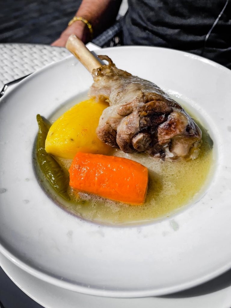 broth with chicken and carrot on plate