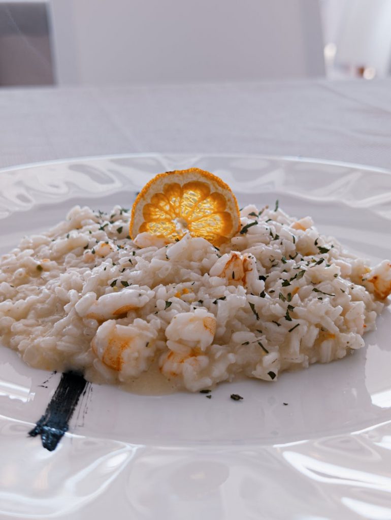 gourmet seafood risotto with citrus garnish