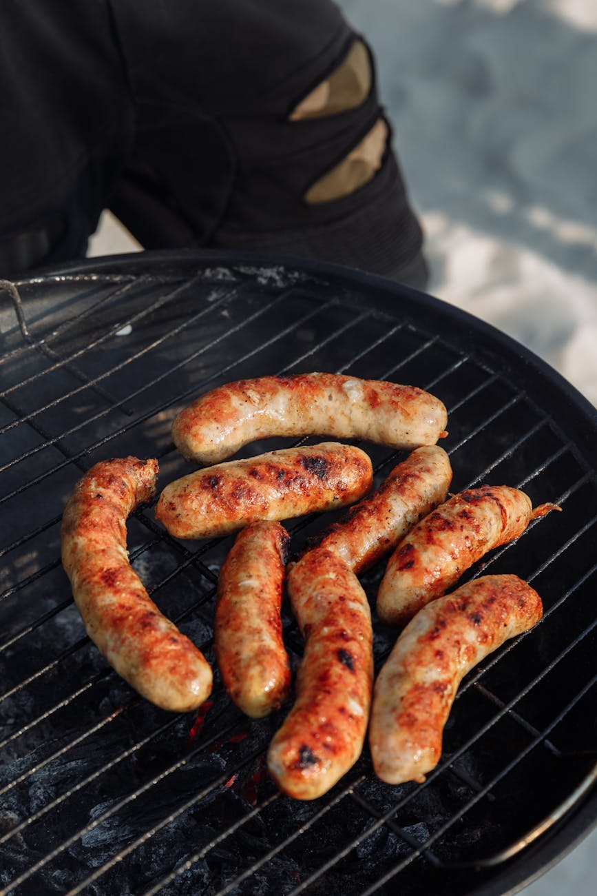 sausages on a charcoal griller