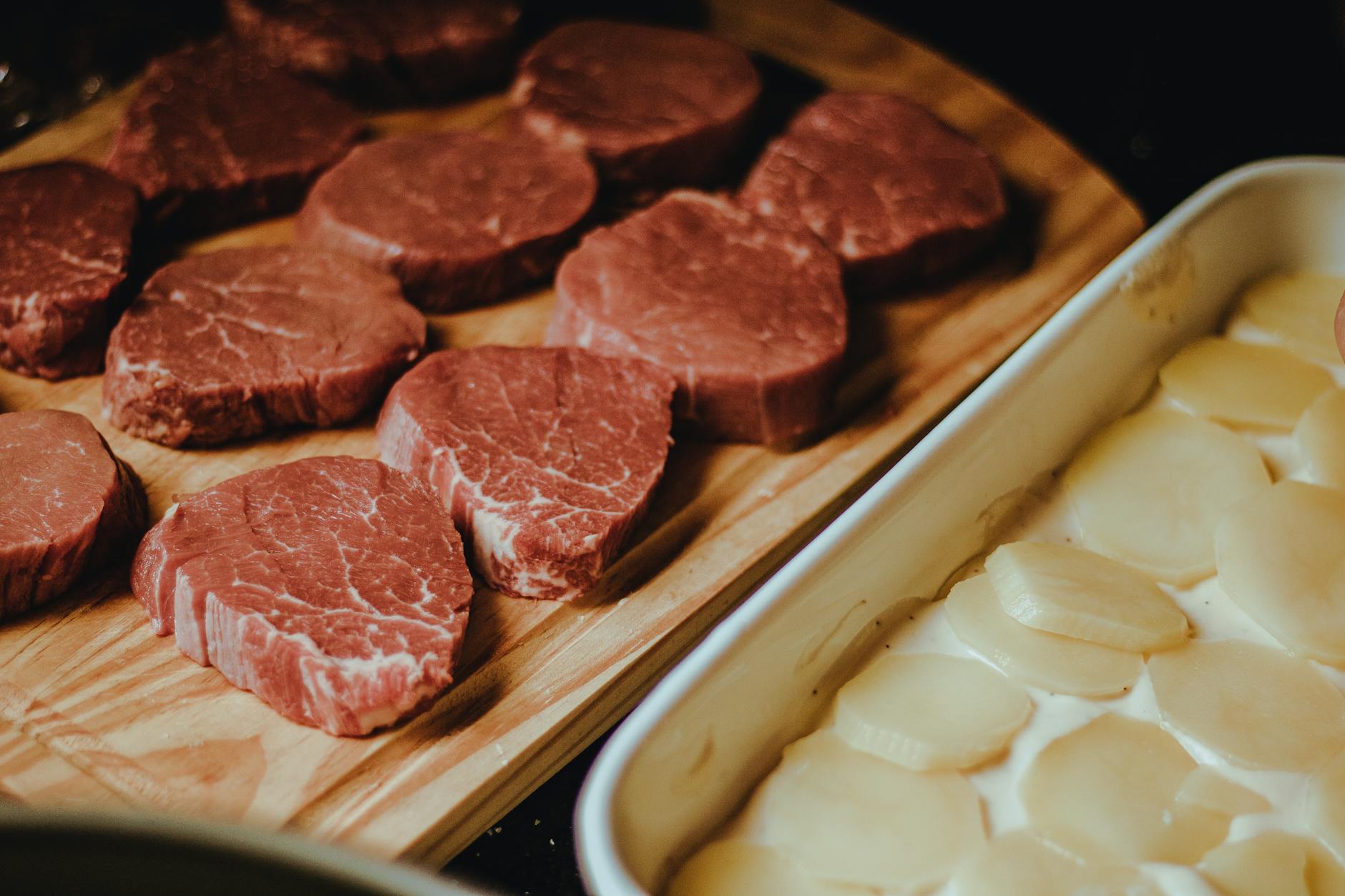 sliced meat on wooden tray