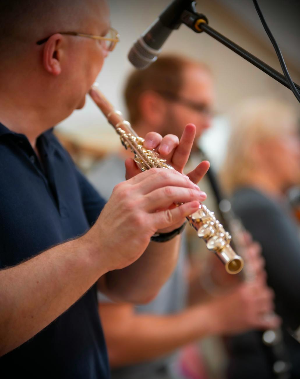man playing on a flute in an orchestra