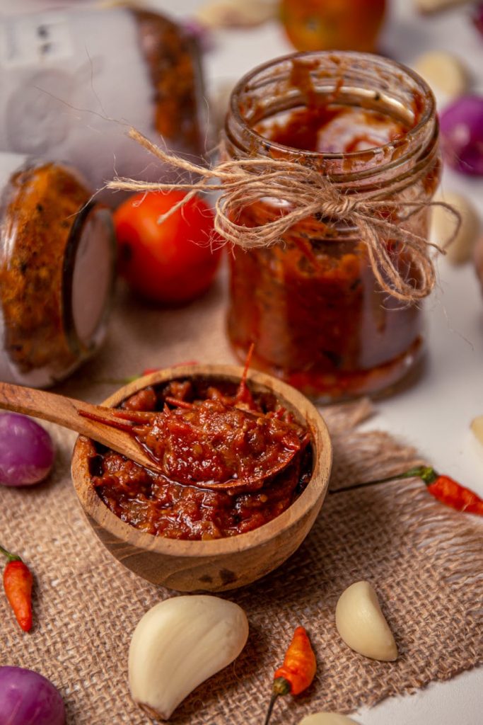 red sauce in clear glass jar