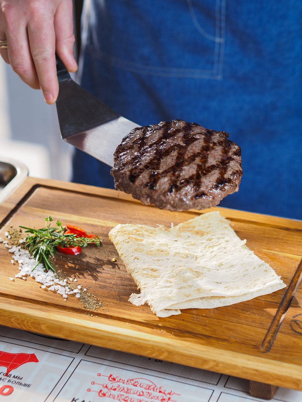 grilled hamburger patty on spatula