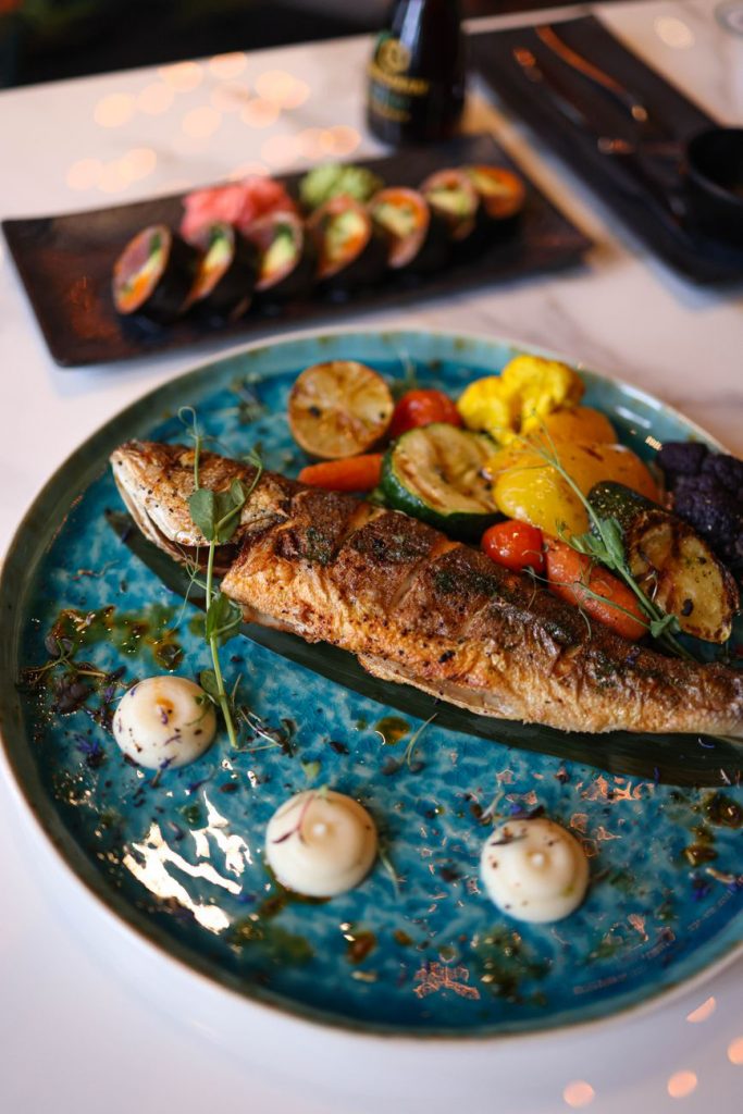 a roast fish on a plate