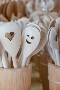 close up of wooden kitchen spoons with cutouts