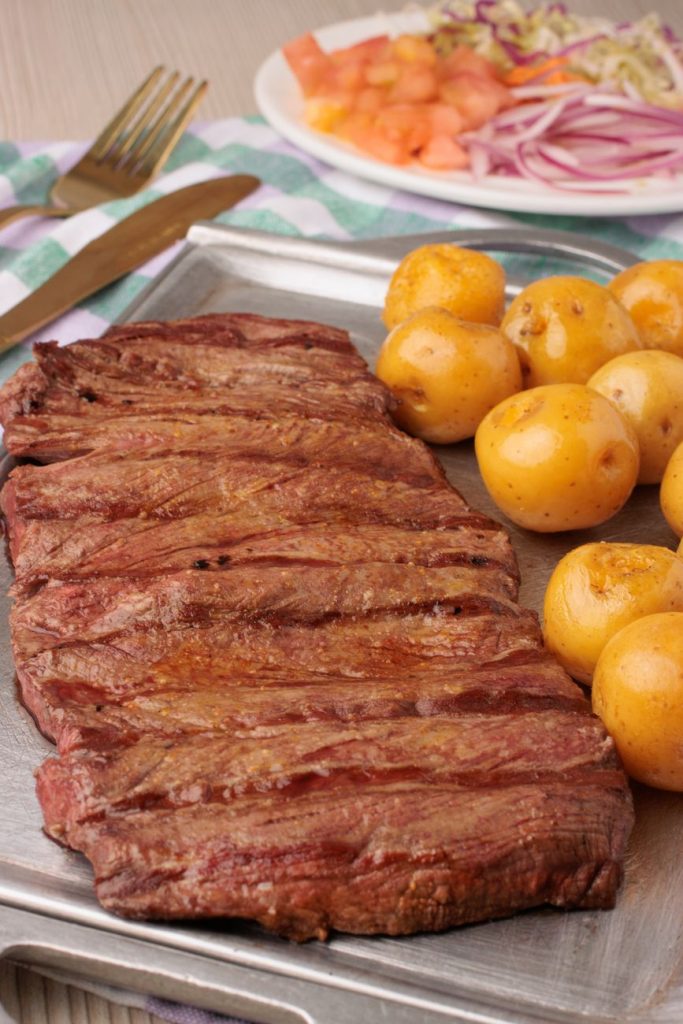 grilled beef with potatoes and fresh salad