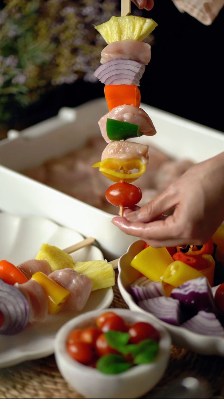woman hand holding vegetables on stick