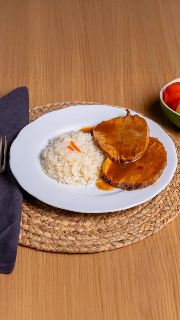 delicious roast beef with rice on white plate