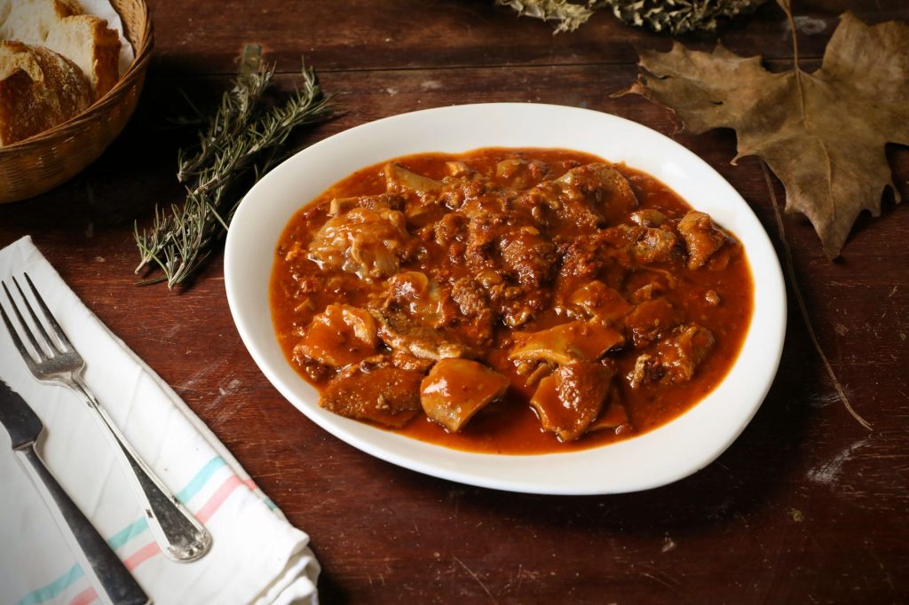 rustic italian tripe stew with bread and herbs