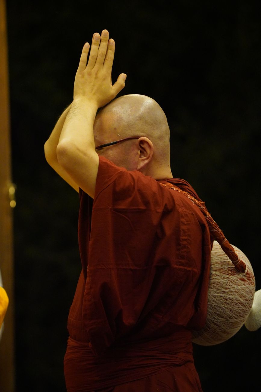 buddhist monk in devotion during ritual