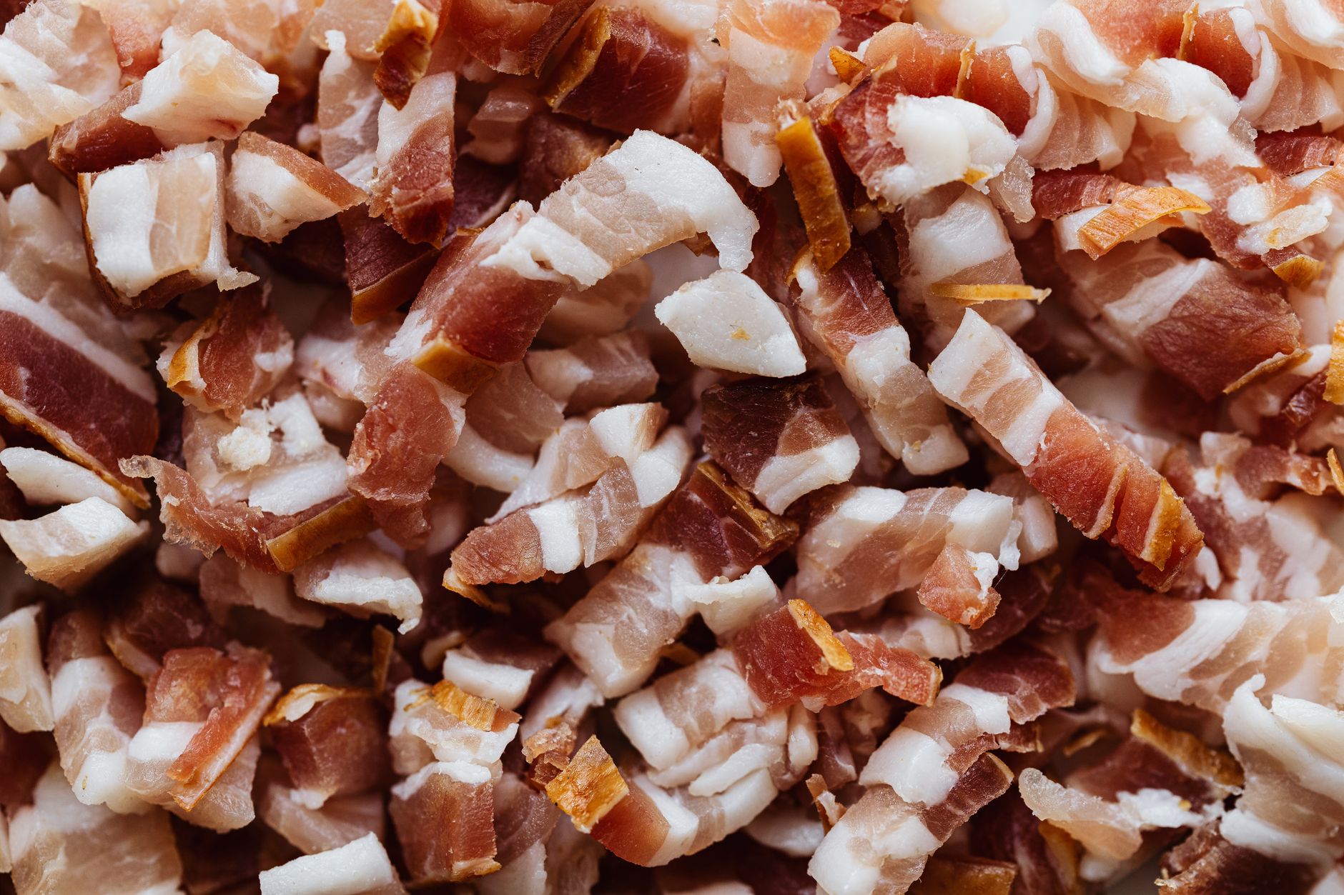 heap of bacon cut into small slices
